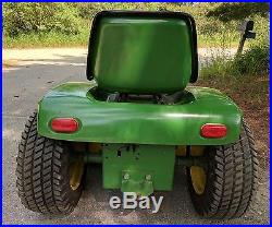 1969 John Deere 112 Riding Mower with plow and snow blower. Runs great
