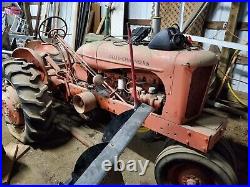 Allis-Chalmer 1948 (model WD) with two bottom plow and side mower