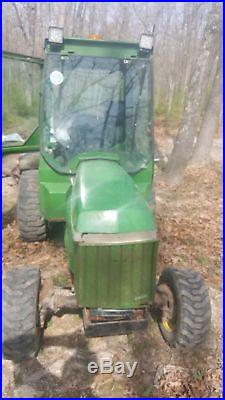 Curtis cozy cab john deere 955 with heat, wipers, lights etc. And jd Snow plow