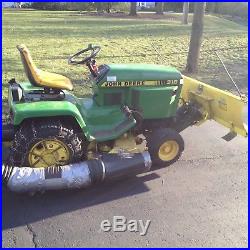 John Deere 318 hydrostatic lawn tractor, hydraulic plow and vacuum trailer