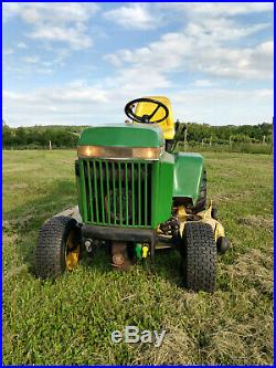 John Deere 318 tractor with snow plow, box blade