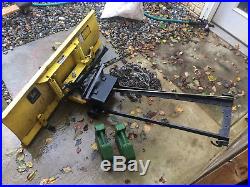 John Deere 48 inch snow plow, weights, and chains