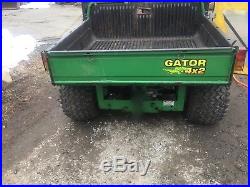 John Deere 4X2 Gator + Curtis Cab + Deere 6' Plow