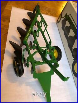 John Deere 4 Bottom Plow by Ertl toys in 1/16th scale F660H NIB Made in U. S. A