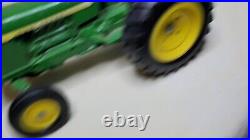 John Deere ERTL #854 Tractor with 4 Drop Bottom Plow Used