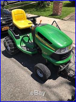 John Deere L115 Lawn Tractor With Snow Plow and Chains