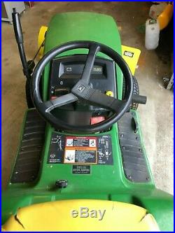 John Deere LX176 Lawn Tractor with lawn deck, plow. Chains and weights