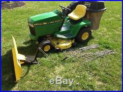 John Deere LX188 tractor with plow chains and grass bagger