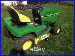 John Deere LX188 tractor with plow chains and grass bagger