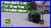 John_Deere_S130_Tractor_With_Snow_Plow_Pushing_Snow_01_ut