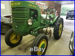 John Deere Starter L Antique Tractor 1939 With One Bottom Plow. Cultivator