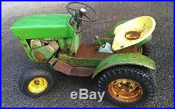 John deere 110 round fender tractor with plow and snow thrower