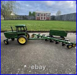 VTG Ertl Co. John Deere Dyersville, lowa USA 52040 with6 bottom plow and trailer