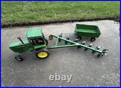 VTG Ertl Co. John Deere Dyersville, lowa USA 52040 with6 bottom plow and trailer