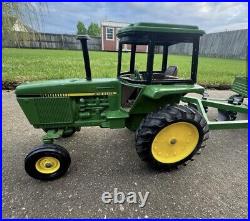 VTG Ertl Co. John Deere Dyersville, lowa USA 52040 with6 bottom plow and trailer