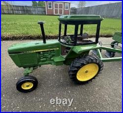 VTG Ertl Co. John Deere Dyersville, lowa USA 52040 with6 bottom plow and trailer