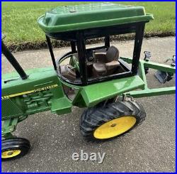 VTG Ertl Co. John Deere Dyersville, lowa USA 52040 with6 bottom plow and trailer