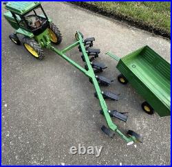 VTG Ertl Co. John Deere Dyersville, lowa USA 52040 with6 bottom plow and trailer