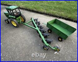 VTG Ertl Co. John Deere Dyersville, lowa USA 52040 with6 bottom plow and trailer