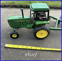 VTG Ertl Co. John Deere Dyersville, lowa USA 52040 with6 bottom plow and trailer