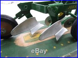 Vintage John Deere Plow with original box and 50th anniversery tractor